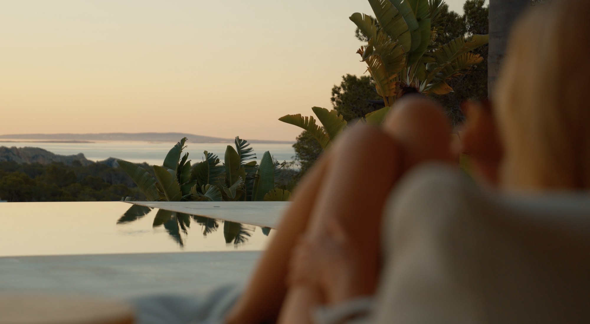 Preview still from the Rise showreel: a villa terrace overlooking the sea at golden hour
